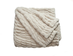 Folded GOLDIE LUXE ivory textured blanket with raised stripe pattern